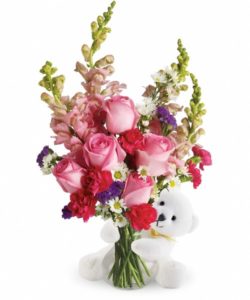 pink bouquet with bear hugging the vase