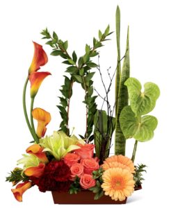 calla lilies and orchids in dish