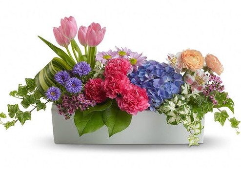 Whether you are invited to a garden party, or just want to celebrate with some dear friends, this spring centerpiece should be on your list. With more personality and aplomb than most parties have to begin with, this show-stopper is sure to please!