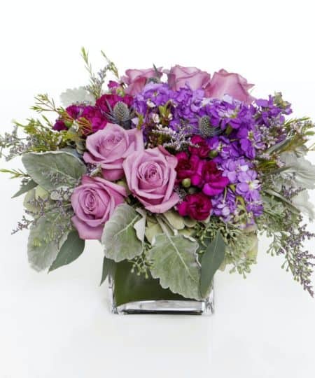 Our modern Lilac and Lavender cube is filled with a mix of lilac and lavender colored roses and an assortment of lavender and purple hues.