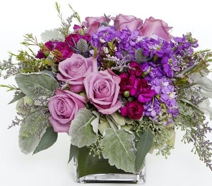 Our modern Lilac and Lavender cube is filled with a mix of lilac and lavender colored roses and an assortment of lavender and purple hues. 
